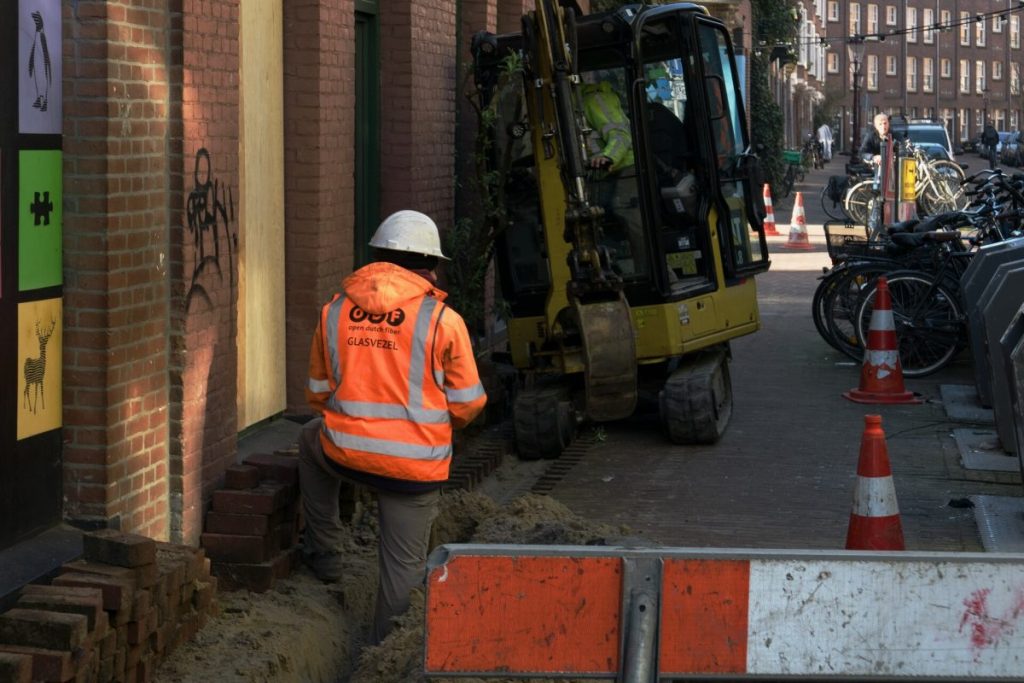 Workers laying cables in the street